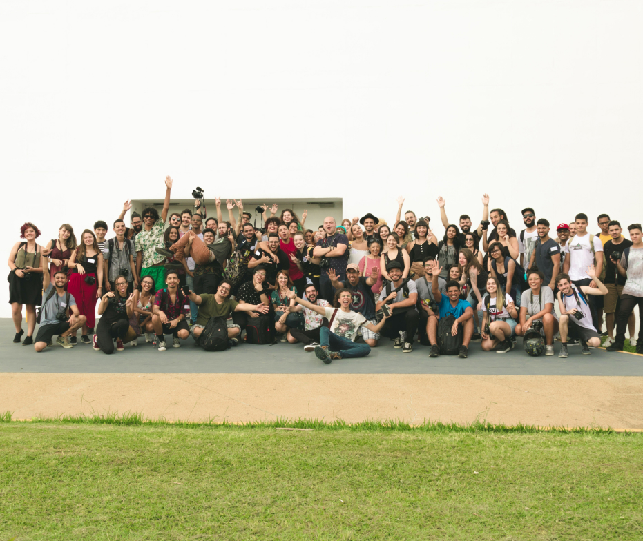 A large group of people standing together outside